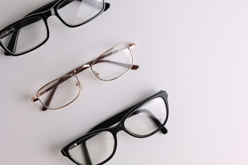 glasses for vision correction on a light background with a place for text