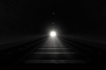 3D rendering of darken train tunnel with light at the end