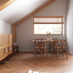 Blurred background, minimal wooden dining room with sloping ceiling and herringbone parquet. Classic table and chairs. Japandi style, attic loft interior design