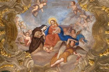 Tuinposter GENOVA, ITALY - MARCH 5, 2023: The fresco of Madonna with the St. Theresa of Avila among the angels in the church Chiesa di Santa Maria Maddalena from 18. cent. © Renáta Sedmáková