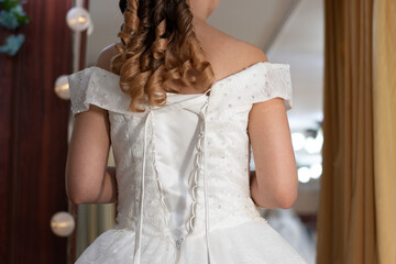 white wedding dress with corsage, lace system