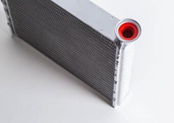 New car radiator car stove on a white background, close-up