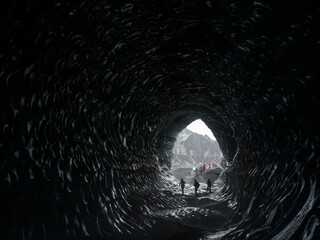 Tourists visiting the Katla Ice Cave, Mýrdalsjökull Glacier, South Iceland.