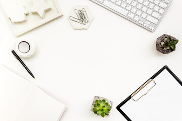 Stylish white working table desk with office supplies, top view