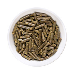 Vegan organic fertilizer pellets, in a white bowl. Naturally produced meadow clover fertilizer, to be added to soil or plants to provide nitrogen, phosphorus and potassium, and to sustain growth.