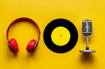 Podcasts or music concept with vinyl records and microphone, top view