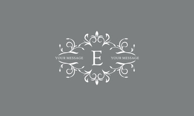 An elegant floral monogram design template for one or two letters, for example E. Wedding monogram. Vector illustration of the logo.
