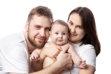 Close up portrait of young parents and baby. Father and mother kiss and hug a beautiful little son. The concept of love, happy fatherhood and motherhood.