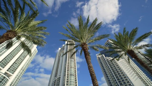 Sunny Isles Beach city with luxurious highrise hotels and condo buildings on Atlantic ocean shore. American tourism infrastructure in southern Florida