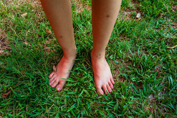feet in grass