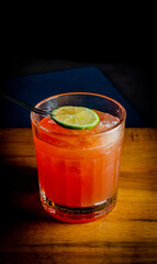 glass of whiskey gin lemon