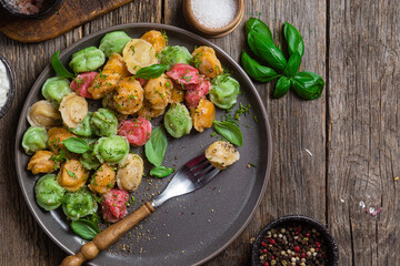 colorful dumplings in a bowl with sauce