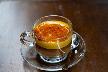 Traditional Egg Coffee on Street of Hanoi Old Quarters Vietnam. The coffee flavours and texture is so delicious a must coffee to try when your in Vietnam 