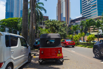 Street of Colombo, the capital of Sri Lanka, with a vehicle called tuk tuk - obrazy, fototapety, plakaty