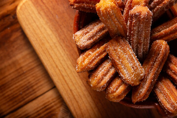 Churros. Fried wheat flour dough, a very popular sweet snack in Spain, Mexico and other countries where it is customary to eat them for breakfast or snack accompanied by hot chocolate or coffee.
