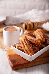 Churros. Fried wheat flour dough, a very popular sweet snack in Spain, Mexico and other countries where it is customary to eat them for breakfast or snack accompanied by hot chocolate or coffee.