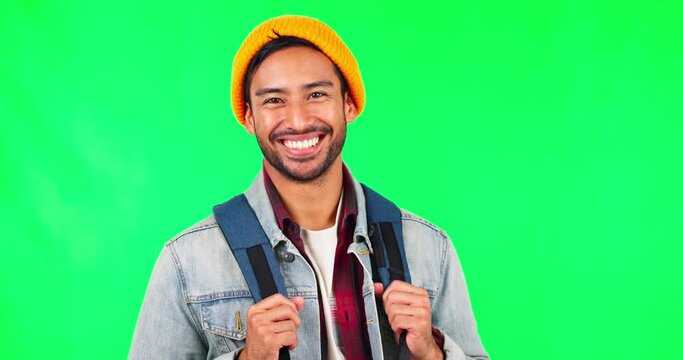Student man, backpack and green screen with smile on face for learning, study or college mockup by background. Happy asian guy, education and travel in gen z fashion, excited or ready for university