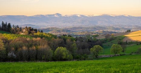 Fototapeta na wymiar amazing spring landscape of karkonosze mountains and green hills in Poland during sunrise