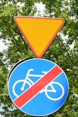 Yield sign and end of bike path sign