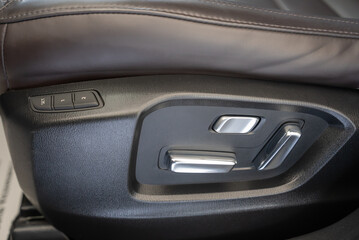 Obraz na płótnie Canvas a close up of a car chair control panel 