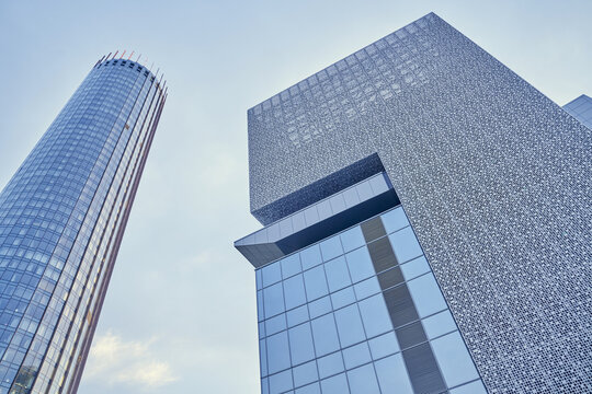 Business buildings in the city center. With space to copy. A view from below of modern skyscrapers in the business district against the blue sky. High quality photo
