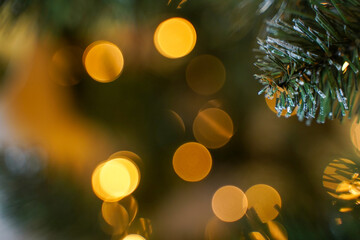 Spruce branch with bokeh lights. Christmas concept. Christmas new year year background template. Shallow focus. Copy space.