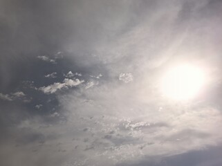 Cirrostratus with the bright sun in the sky