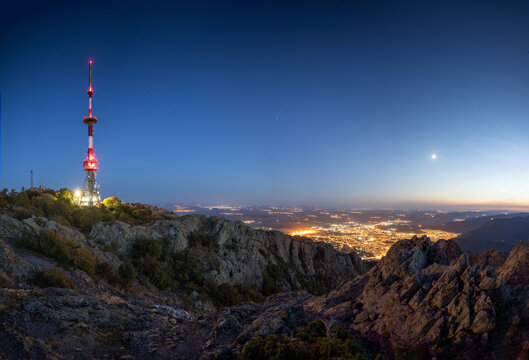 Sunset over the mountain hills and Sliven city, aerial panoramic view