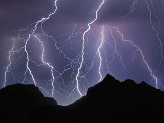 lightning in the night over mountains