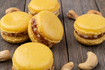 Cashew nut macarons over wooden table