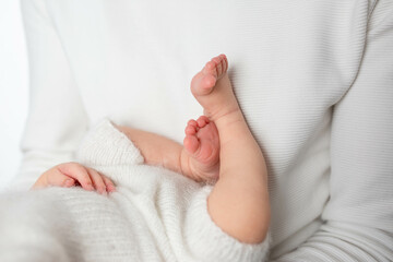 twisted child. Soft feet of a newborn.