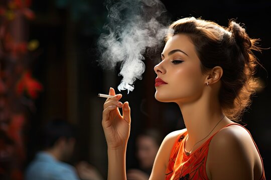 Sensual attractive young woman smoking a cigarette 