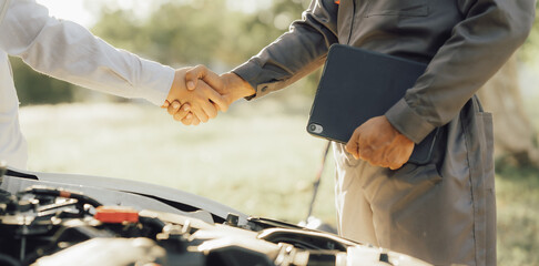 The male mechanic's hand holds the wrench Are showing solidarity with colleagues , Concept of engineer and auto repair