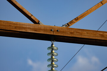 Power line pylon detail against a sky