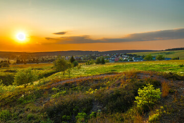 Color evening meadow near Bozi Dar village with sunshine