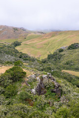 Fototapeta na wymiar Rolling hills in San Luis Obispo county with low lying coastal clouds