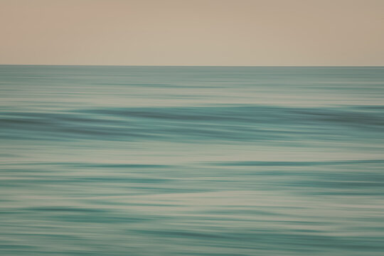 Abstract seascap, sunset. Motion blur, light vintage colors