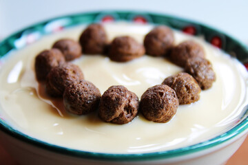 Heart formed with chocolate cereal and yogurt