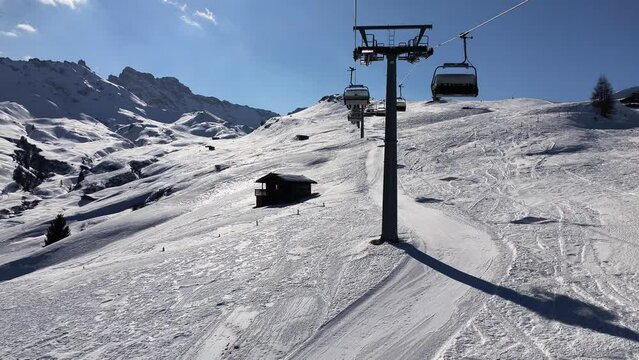 4k video with skiing season footage in the Dolomites mountains in Italy on a beautiful sunny day