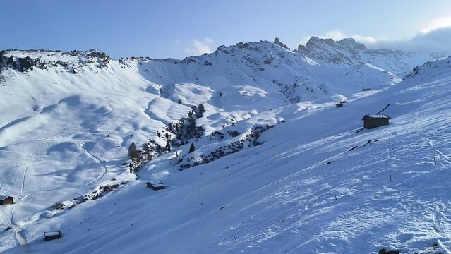 4k video with skiing season footage in the Dolomites mountains in Italy on a beautiful sunny day