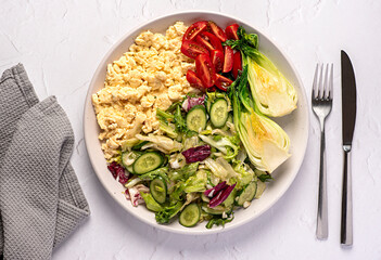 Food photography of breakfast; scrambled egg; fried; crispy; bok choy; cucumber; leaf; brunch