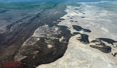 Seasonal salt lake Ntvetwe Pan, with changing coastline and evaporating surface in Botswana view from height of 1500 m.