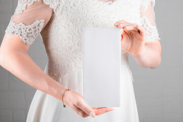 Bride holding wedding menu card mockup on white wall background. Minimal stile blank mockup, thank...