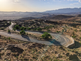 A road winding up a mountain in a great mountain landscape in the Anti-Atlas