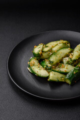 Delicious juicy cucumber cut into large slices with salt, spices and french mustard