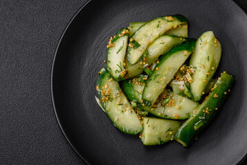 Delicious juicy cucumber cut into large slices with salt, spices and french mustard