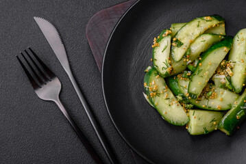 Delicious juicy cucumber cut into large slices with salt, spices and french mustard