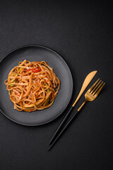 Delicious asian udon dish with vegetables, mushrooms, salt and spices