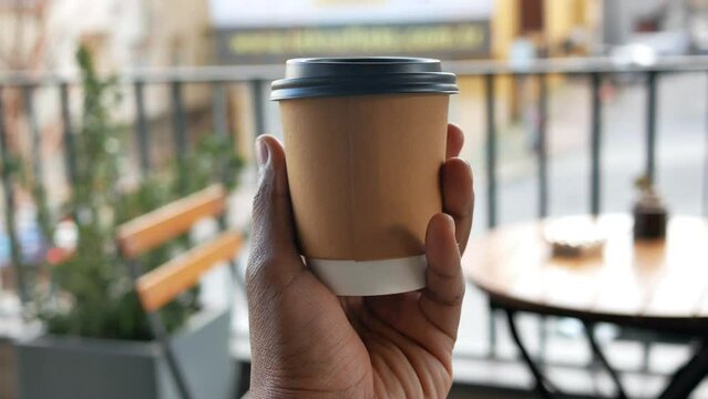 pov shot of men holding a Blank take away kraft coffee cup 
