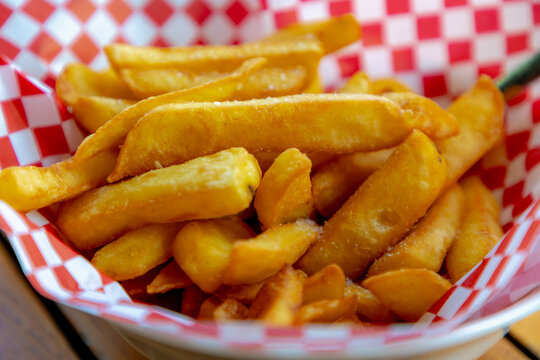 Selective focus of french fries in the basket on table, Friet or Patat served with mayonnaise, Fritessaus or frietsaus is a Dutch accompaniment to French fries, Served popularly nationwide.